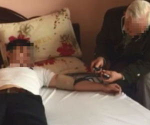 "Thần y" chữa AIDS và cuộc thăm khám bí hiểm trong khách sạn