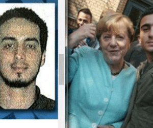 Xác định nhân vật chụp ảnh cùng bà Merkel gây tranh cãi