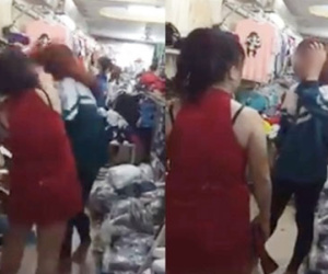 Cô gái mặc áo đồng phục bị bắt quả tang trộm giày ở shop