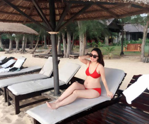 Á hậu Ngô Trà My khoe bụng bầu lớn khi mặc bikini