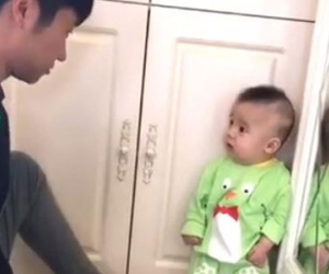 Dân mạng "bấn loạn" trước biểu cảm siêu đáng yêu của bé trai khi bị bố mắng