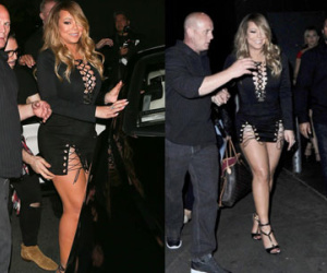 Mặc váy xẻ táo bạo, Mariah Carey khốn khổ khi bước lên xe