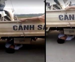 Bị tạm giữ xe do vi phạm giao thông, nam thanh niên chui vào gầm xe ôtô CSGT "ăn vạ"