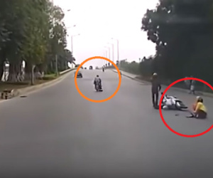Clip: Bị cướp túi xách, mẹ vẫn ôm chặt con khi văng xuống đường