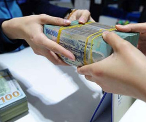 Vì sao tỷ giá USD/VND chưa… bùng?
