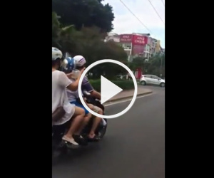 Video: Bố lái xe mẹ bón cơm cho con trên xe máy