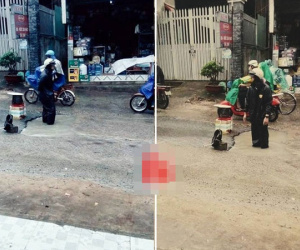 Người đàn ông đứng trong ổ gà dưới mưa gây tranh cãi