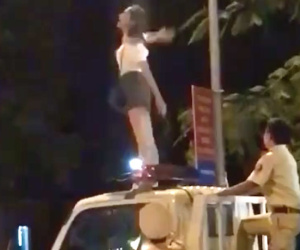 Nam Định: Cô gái trèo lên nóc xe CSGT nhảy múa la hét