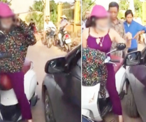 Cô gái cởi áo, chửi lái xe ô tô như "tát nước" rồi xông vào đánh nhau vì bị nhắc nhở khi đứng giữa đường nghe điện thoại