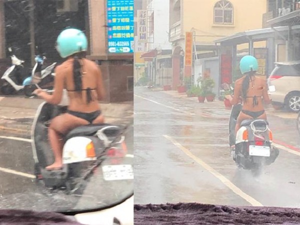 Mặc bikini bé xíu rồi lái xe máy giữa trời mưa, cô gái khiến dân tình 'nóng mắt'