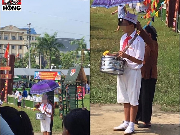 Cảm động hình ảnh người bà bé nhỏ lấy ô che nắng cho cháu gõ trống