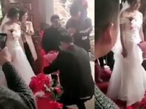 Quỳ 2 gối cầu hôn ngay trong đám cưới nhưng chú rể phải nhận lại nét mặt 'lạnh như tiền' của cô dâu chỉ vì thứ đang cầm trên tay