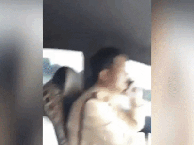 Xôn xao clip thiếu tá CSGT không cài dây an toàn, vô tư vừa lái xe vừa nghe điện thoại