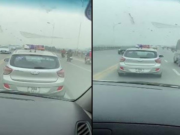 Tài xế taxi nghênh ngang cản đường xe cấp cứu trên cầu Vĩnh Tuy