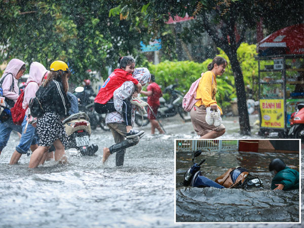 Người Sài Gòn ngã sõng soài trong mưa lớn, sinh viên cõng nhau dưới mưa qua 'biển nước' Thảo Điền