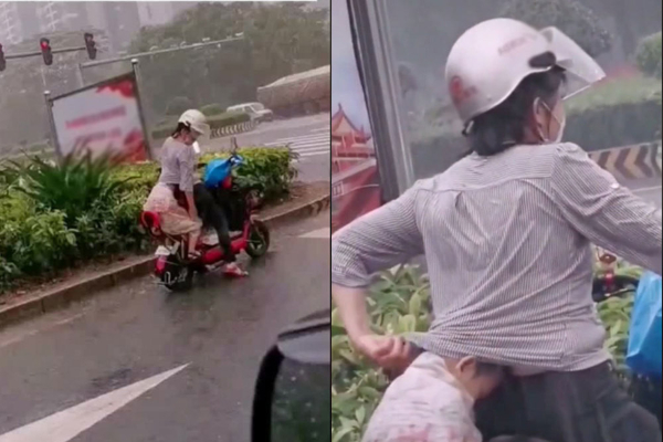 Đón con về giữa trời mưa, việc làm của người mẹ khiến ai cũng cảm động