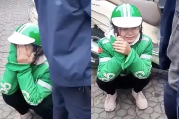 Cho khách mượn điện thoại, cô gái chạy xe ôm bị lừa, ngồi trên vỉa hè khóc rấm rứt