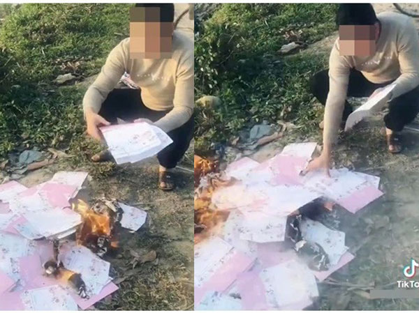 Biết vợ sắp cưới có bầu với người khác, chàng trai vừa khóc vừa đốt hàng trăm tấm thiệp cưới ở bãi rác
