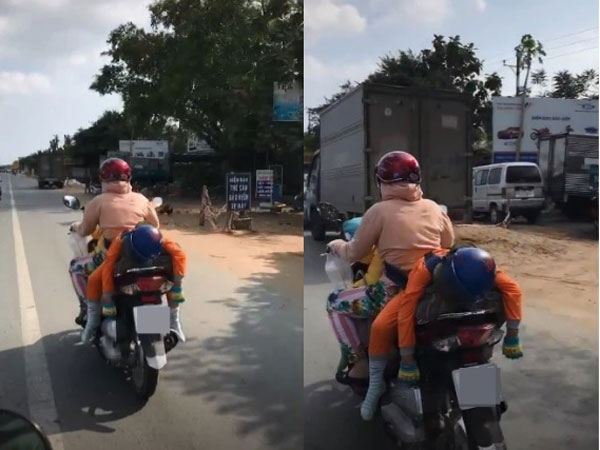 Nhìn từ phía sau thấy cậu bé ngủ trên yên xe máy đang chạy với tư thế lạ, vòng ra đằng trước thì cảnh tượng càng gây ngỡ ngàng hơn