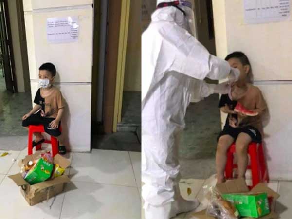 Bé trai 6 tuổi một mình đi nhận kết quả dương tính Covid-19: Ánh mắt ngơ ngác, ngồi nép vào cánh cửa