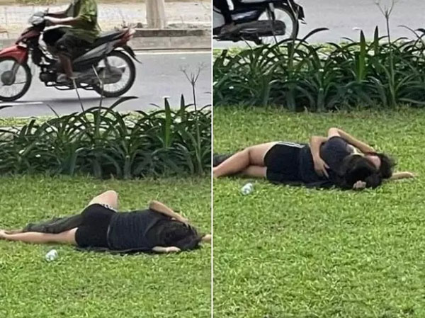 Giữa mùa Covid-19, dân tình phát hoảng với cặp đôi thản nhiên nằm 'đấu vật' trên bãi cỏ tấp nập người qua lại: 'Bao giờ thì công an phường ra 'hốt'?'
