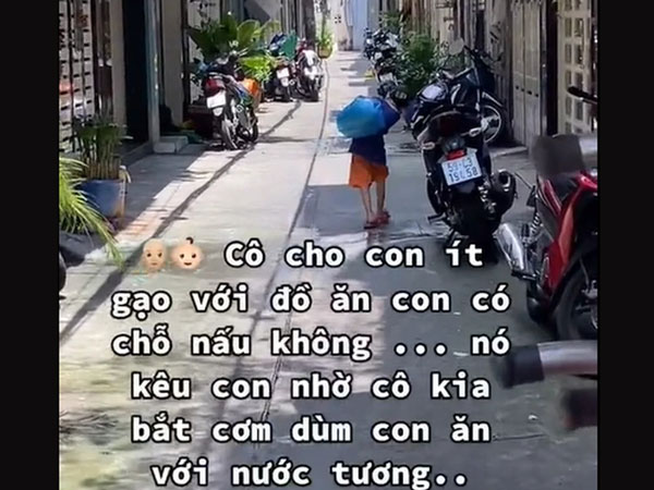 Cậu bé làm nghề 'rồng phun lửa' trên phố Bùi Viện, hồn nhiên tới đau lòng: 'Ba con mất rồi, dính Covid á'