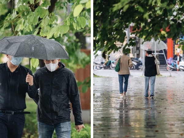 Ảnh: Người Hà Nội co ro trong cơn mưa tầm tã kết hợp không khí lạnh tăng cường