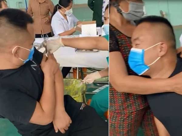 Clip: Nam thanh niên cường tráng nhắm tịt mắt, nép vào lòng mẹ khi tiêm vì sợ hãi khiến dân tình cười bò