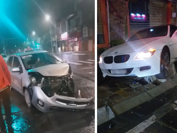 Ô tô BMW bị hất văng lên vỉa hè sau va chạm với xe taxi lúc rạng sáng