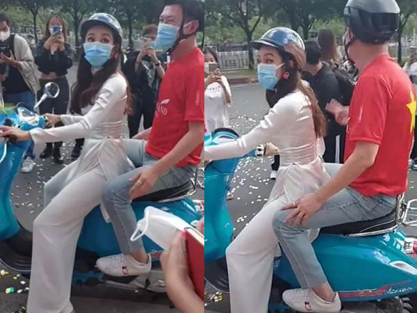 Thùy Tiên diện áo dài trắng, 'đèo' chủ tịch Miss Grand bằng xe máy siêu dễ thương