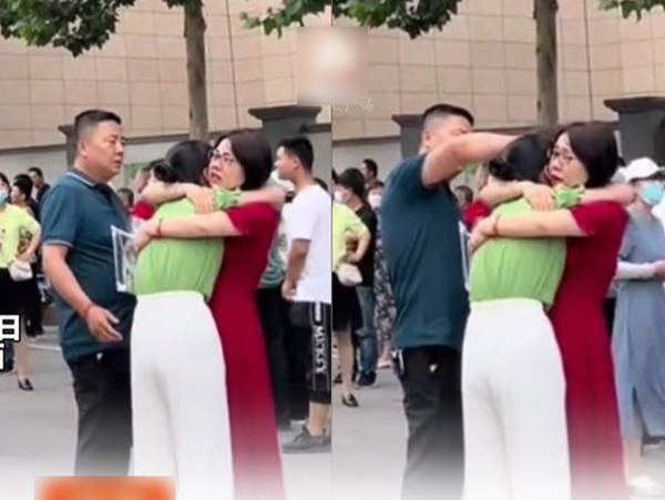Ấm lòng hình ảnh nữ sinh đi thi đại học không làm được bài chạy ra òa khóc nức nở được mẹ ôm chặt an ủi còn bố bên cạnh vỗ về