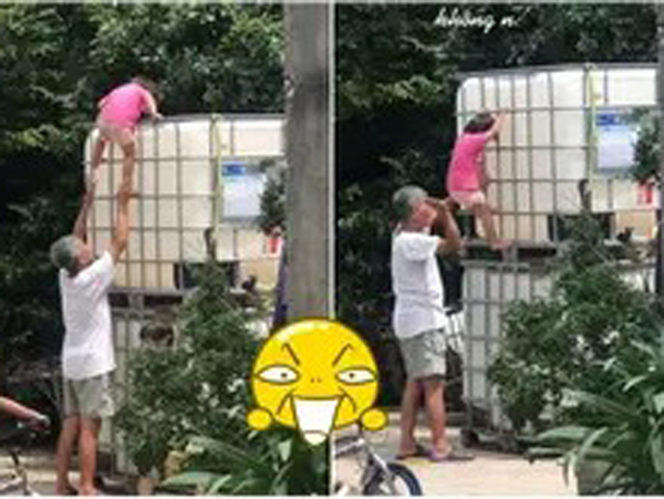 Ông ngoại thót tim đỡ cháu gái trèo xuống từ nóc bồn chứa nước cao ngất, cái kết khiến dân tình cười ná thở vì 'quá yêu!'