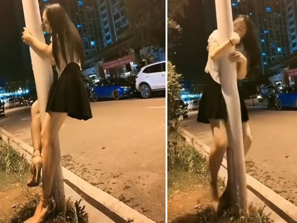Gái xinh mặc váy ngắn, 'quện' vào cột điện ôm hôn thắm thiết trong đêm