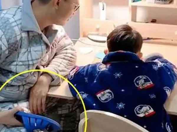 Bố gãy tay vì kèm con làm bài tập về nhà