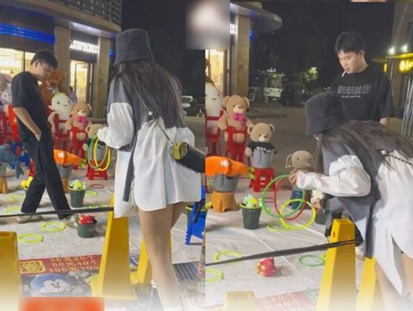 Sốt ruột vì cô gái ném vòng mãi không trúng, chủ quán 5 lần 7 lượt giảm độ khó, thiếu điều dâng con gấu bông vào trước mặt mà khách nữ vẫn 'game over'