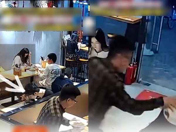 Đang ngồi yên lành trong quán ăn, người đàn ông bỗng cầm bát mỳ ụp lên đầu khách nữ rồi chạy thẳng