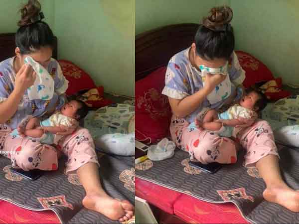 Mẹ bỉm vừa ôm con vừa khóc nức nở: 'Dỗ mãi con không nín nên khóc theo'