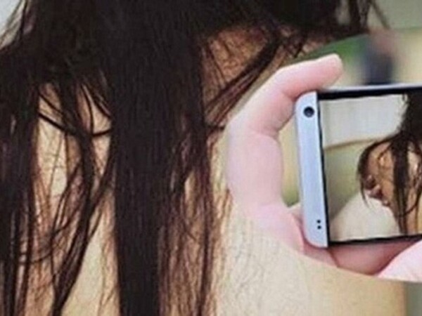 Xông vào nhà nghỉ quay clip người tình quan hệ với người đàn ông khác rồi tống tiền