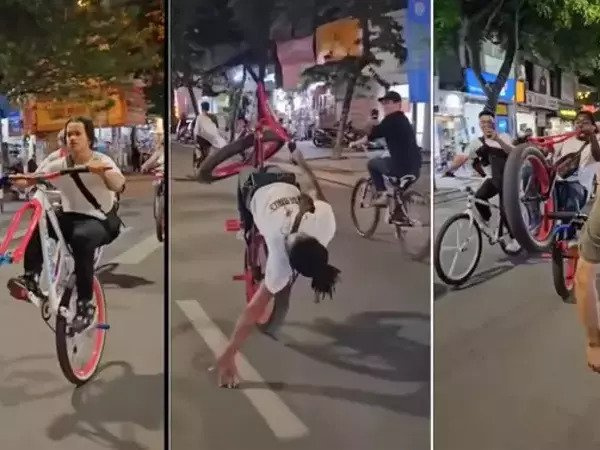 Nhóm người nước ngoài đi xe đạp bốc đầu, đánh võng trên đường phố Hà Nội