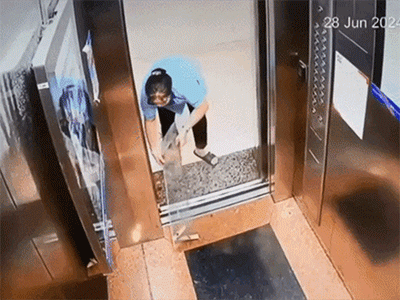Nữ lao công dùng tấm kính chặn cửa thang máy chung cư và cảnh tượng sau đó khiến nhiều người hú vía