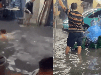 Người Hà Nội và trăm kiểu 'chill' trong mênh mông biển nước: Từ ung dung trùm áo mưa ngồi nhậu đến bơi lội giữa phố Tạ Hiện