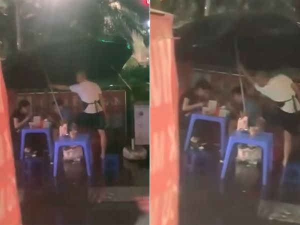 Clip thanh niên che ô cho khách ngồi ăn giữa trời mưa 'gây bão' mạng
