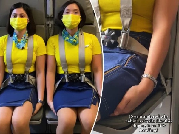 Vì sao các tiếp viên hàng không có tư thế 'kỳ quặc' ngồi lên tay mình khi cất cánh và hạ cánh?