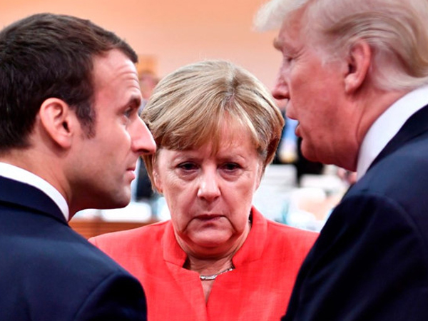 Merkel cân nhắc cùng Macron đối đầu Trump ở Davos