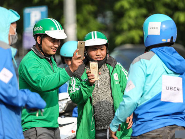 Ngành thuế yêu cầu Grab nộp thuế chuyển nhượng thay Uber