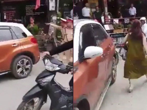 Bị nhắc đỗ xe gây cản trở, nữ tài xế lái xe chặn ngang đường thách thức CSGT