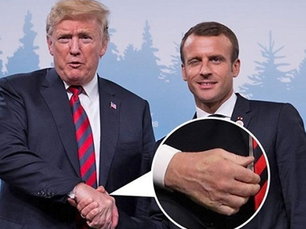 Tay Trump hằn vết sau cú bắt tay với Macron