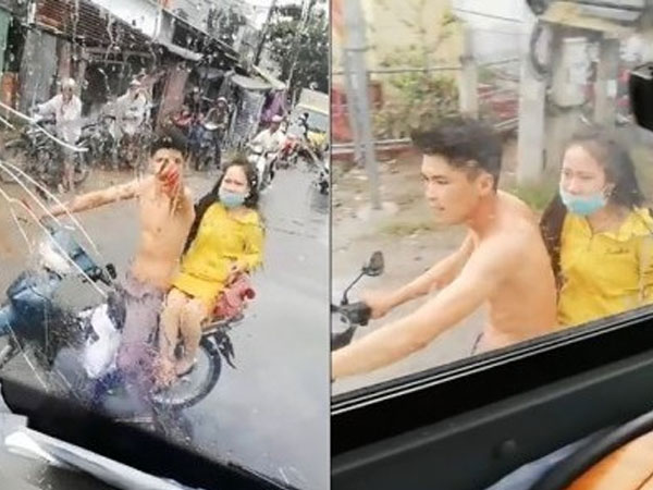Video: Bị tạt nước ướt hết người, thanh niên đi xe máy 'nện' gạch vỡ kính lái ô tô
