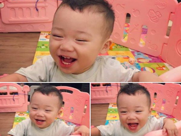 Hình ảnh con trai bella cười toe toét khoe 8 chiếc răng dù bị mắng tội nghịch phá cũi được chia sẻ khiến nhiều người thích thú