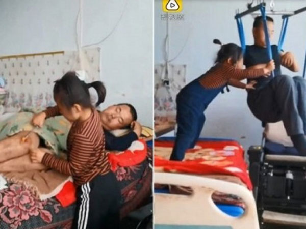 Xúc động hình ảnh bé gái 6 tuổi một mình chăm sóc cha tàn tật